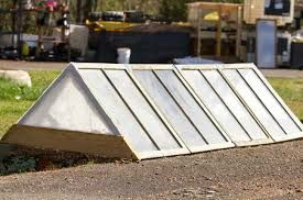 Greenhouses can be coldframes, high tunnels, covered in plastic or old windows, and even placed over trenches!