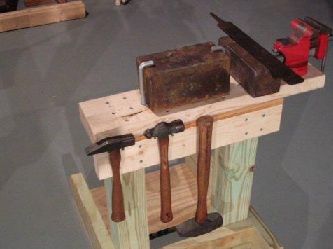 With this makeshift anvil, hammers and file, you can make replacement blades for tools.