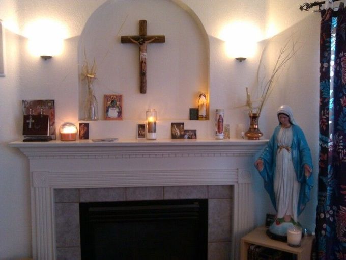 Using your livingroom mantle as your home altar seems a natural place to gather for the Holy Rosary and other prayers.